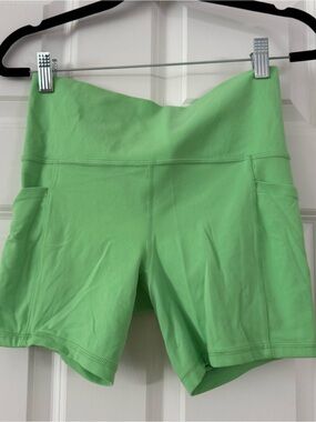 Athleta High-Rise Bike Shorts in Bright Lime Green